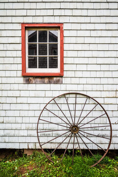Canada, Prince Edward Island, Orwell. Barn with old wagon wheel.