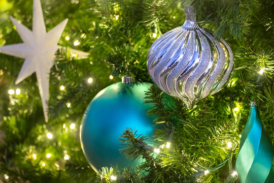 Christmas ornaments and lights on an artificial tree