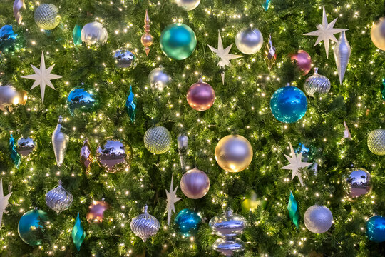 Christmas ornaments and lights on an artificial tree