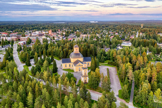 Finland, Kainuu. Aerial view of Evangelical Lutheran church and the city of Kuhmo at dusk