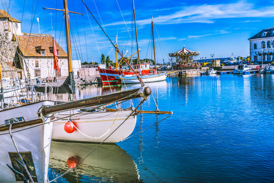 Colorful marina, Inner Harbor, Honfleur, France. Honfleur is famous for its reflections, which inspired Monet