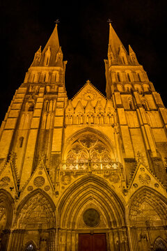 Illuminated Bayeux Cathedral facade Towers Our Lady of Bayeux Church, Bayeux, Normandy, France. Catholic church consecrated by King William the Conqueror in 1077