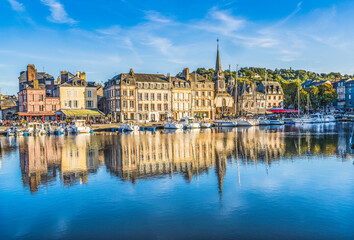 Colorful marina, Inner Harbor, Honfleur, France. Honfleur is famous for its reflections, which inspired Monet