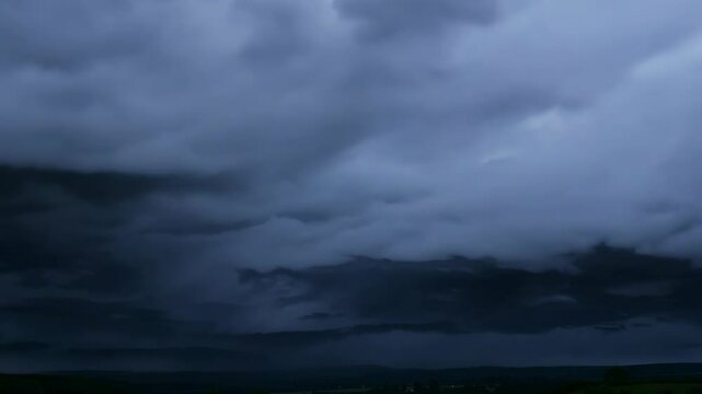Thunderstorm rolls in over the mountains at dusk