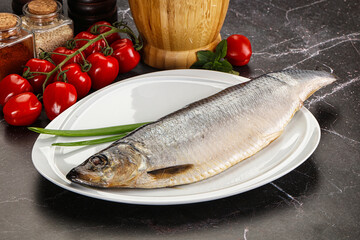Whole raw salted herring fish