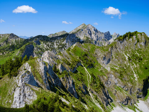 View towards Mt. Hochplatte, Mt. Vorderscheinberg and a doline called Kessel. Nature Park Ammergau Alps (Ammergau Alpen) in the Northern Limestone Alps of Upper Bavaria, Germany.