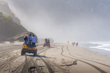 Outback relaxing adventure with 4WD vehicle jeep at the beach of an ocean at sunrise. Travelling with family and adventure togehter © Tito Rollis