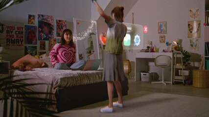 Teenager girl chats with virtual reality hologram in metaverse AI chat sitting on bed with laptop. Futuristic 3D graphics of animated avatar. Technology of AI friend simulation. Augmented reality. - Powered by Adobe