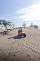 Outback relaxing adventure with 4WD vehicle jeep at the beach of an ocean at sunrise. Travelling with family and adventure togehter