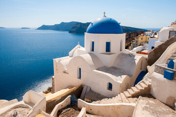 Greece, Santorini, Oia. View of the blue domed Santorini caldera in Oia.