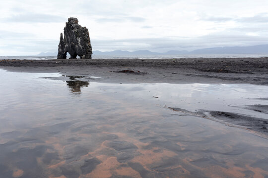 Iceland, Hvitserkur. This sea stack or monolith represents a legend that it was a troll that was turned to stone because it was out during daylight.