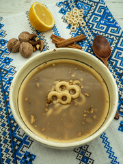 bowl with romanian traditional food known as mucenici muntenesti, served on 9th of March for...