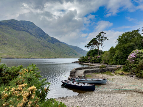 Skiffs await passengers on the shores of Doo Dough, Ireland.