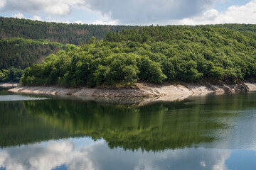 Fototapeta premium The Urfttalsperre also known as the Urft dam or Urft reservoir at Eifel National Park in North Rhine-Westphalia, Germany