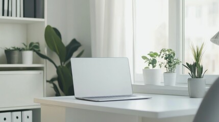 White minimalist workspace with a laptop, clean and organized, modern office design