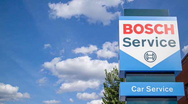 Commercial sign of BOSCH Service Store against slightly clouded sky in 2024. Bosch Carservice is a chain of car repair shops of the well-known German car parts manufacturer Bosch.
