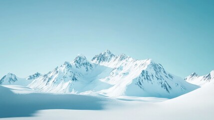 Obraz premium White snow-covered mountain peaks under a clear blue sky, serene and majestic, winter landscape