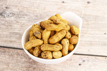 Raw ripe unpeeled peanut heap