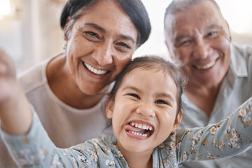 Selfie, funny and portrait of kid with grandparents in home for memory, bonding or family time. Smile, love and face of girl child with grandmother and grandfather for photography picture in house.