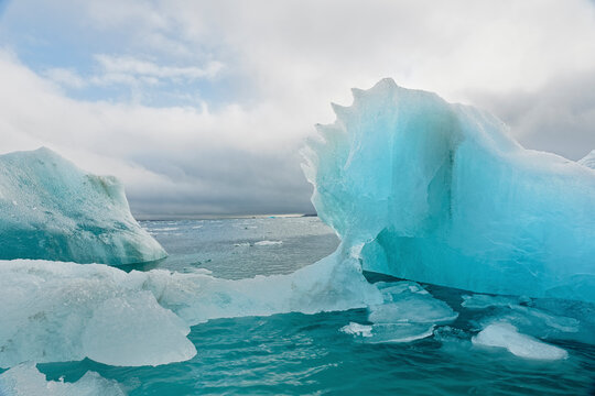 Iceberg adrift in the ocean, Svalbard, Norway.