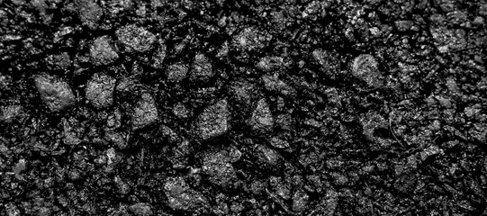 A heap of black natural coal, photo of coal mine background, texture	