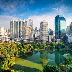 Fototapeta premium Lumpini park and Bangkok city building view from roof top bar on hotel, Bangkok, Thailand
