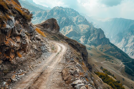 Treacherous off road drive on narrow cliffside road in Caucasus mountains