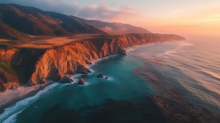 Stunning Aerial View of Rugged Coastline at Sunset with Ocean Waves and a Dramatic Sky.