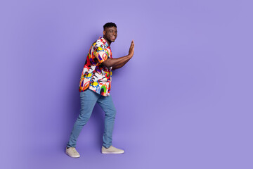 Full size photo of nice young man push empty space wear shirt isolated on violet color background