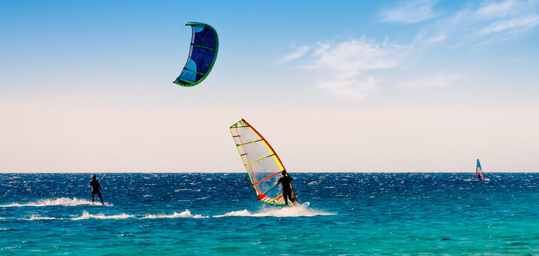windsurfers and kitesurfers ride in the Red Sea in Egypt Sharm El Sheikh