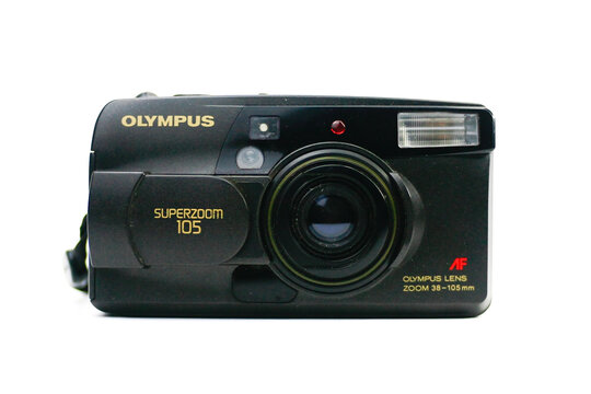 Close up of Olympus Superzoom 105 vintage point and shoot 35mm film camera isolated on white background. Front view