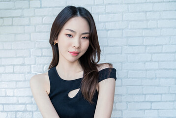 Portrait young beautiful sexy asian korean woman slim fit body. Isolated of touch face facial fashion asian girl looking. Lifestyle japanese makeup, korea people glow skin, beauty asia girl next door. © paulaphoto