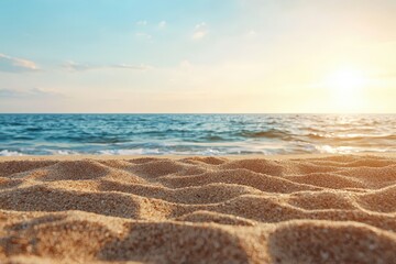 Panoramic beach landscape featuring close-up sea sand, tranquil sunset with orange and golden hues, creating a calm summer mood
