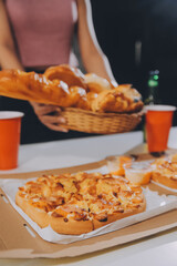 Group of young friends eating pizza.Home party.