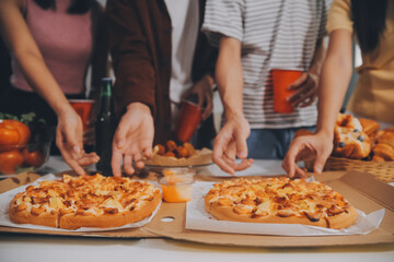 Group of young friends eating pizza.Home party.