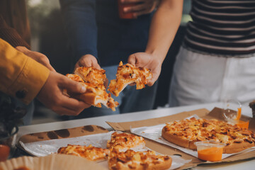 Group of young friends eating pizza.Home party.