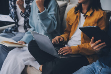Young friends doing school assignment together at home