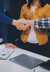 portrait of Business people shaking hands, finishing up a meeting