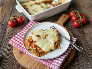 Pasta casserole with greek kritharaki, tomatoes, peppers, onions, garlic and melted mozzarella...