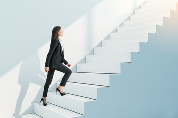 Attractive young businesswoman climbing white stairs and concrete wall. Success, worker, career...