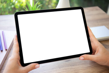 female hands holding computer tablet with isolated screen in cafe