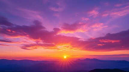 Fototapeta premium a sunset sky deep orange and pink hues blending with darker purples as the day turns to night.