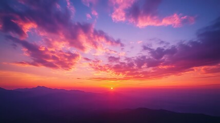 Obraz premium a sunset sky deep orange and pink hues blending with darker purples as the day turns to night.