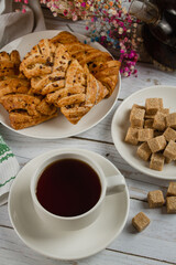 Cup of tea with dessert. Breakfast on a light table