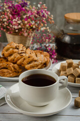 Cup of tea with dessert. Breakfast on a light table