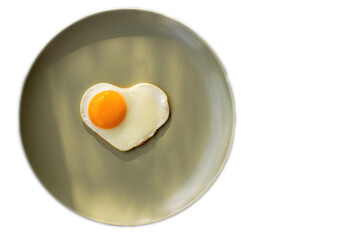 A  fresh soft-boiled egg on a pistachio plate, morning sun light, symbolizing the concept of healthy eating and a good start to the day, isolated on white.