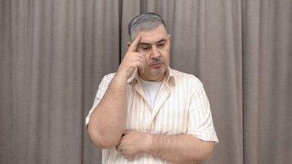 A man deep in thought. Reflections, decision making, doubts.