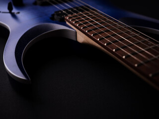 Fretboard of modern electric guitar. Close up.