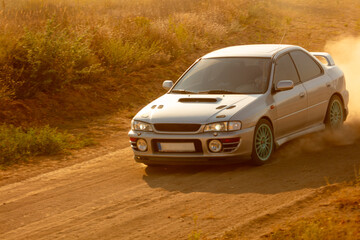 Car on Dirt Road During Sunset
