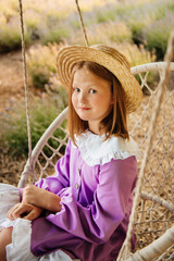 girl sitting on a swing